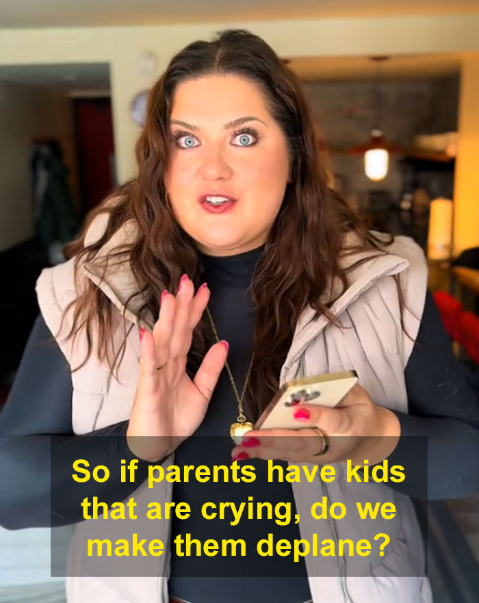 Woman discussing pet travel rules on planes, holding a phone, with text on the image. Woman discussing pet travel rules on planes, holding a phone, with text on the image.