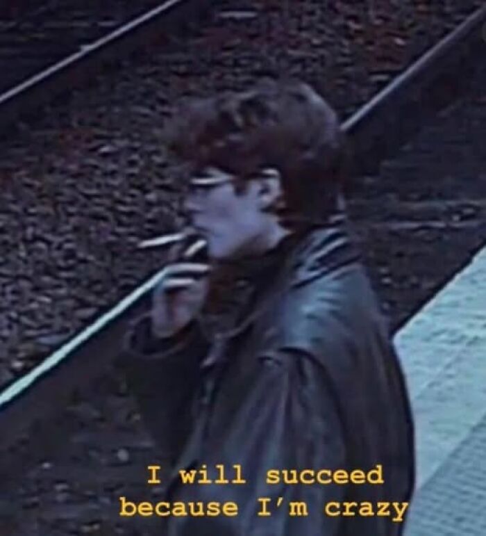 Person smoking on a platform with "I will succeed because I'm crazy" text, reflecting mental health meme humor.