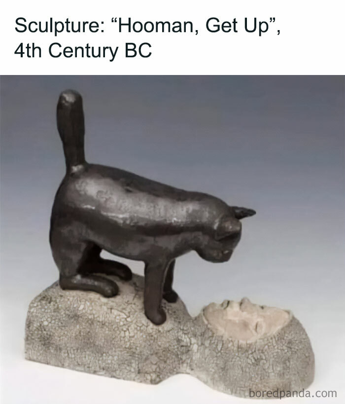 Bronze sculpture of a cat in play mode on a human head, humorously titled "Hooman, Get Up," 4th Century BC stylization.