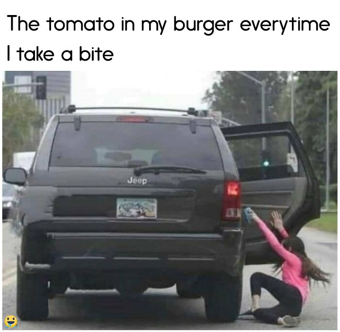 Person in pink chased by car, humorously depicting food struggle with sliding tomato in a burger.
