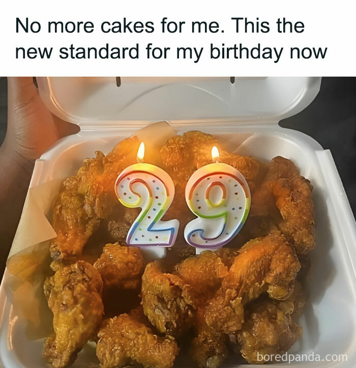 Fried chicken box with 29th birthday candles instead of a cake, highlighting food meme humor.