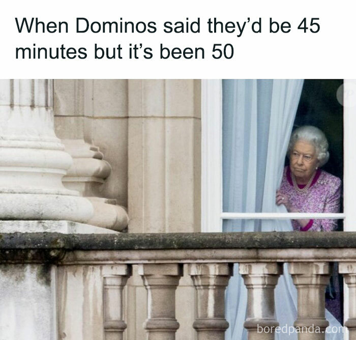 A person peering out a window, frustrated about delayed food delivery, capturing relatable food meme humor.
