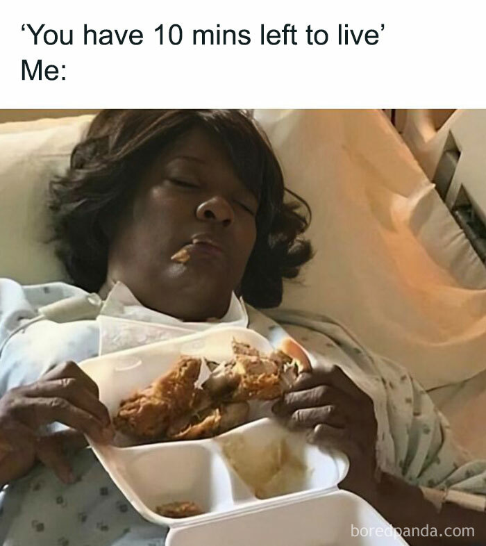 Woman humorously enjoying fried chicken in bed, referencing food memes.