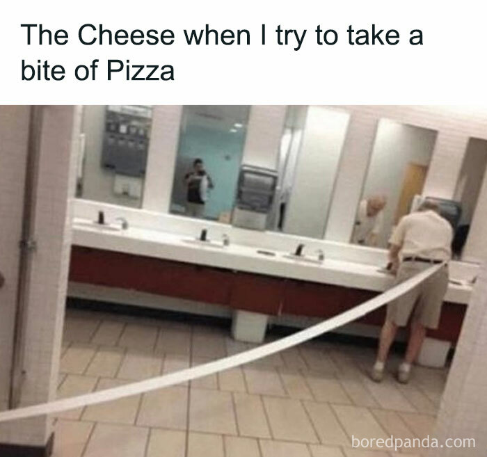 Long strip of paper unraveling in a restroom, humorously compared to cheese pulling from pizza.