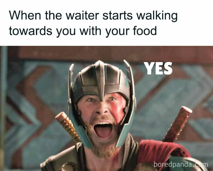 Excited person in armor meme humorously reacting to food arrival.