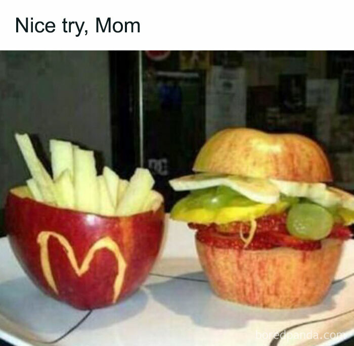 Fruit burger and fries, resembling fast food, made from apples and grapes.