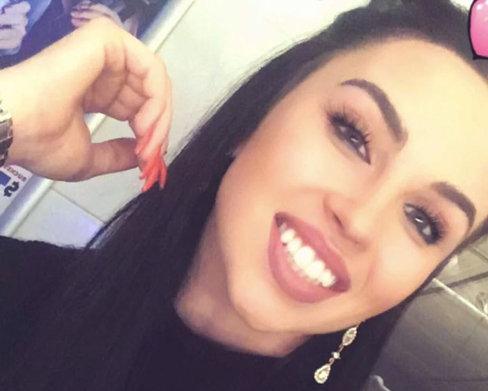 Smiling woman with dark hair and heart filter, related to Florida Man headlines.