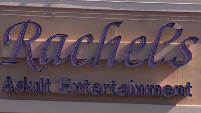 Sign for Rachel's Adult Entertainment, relating to a Florida Man headline.