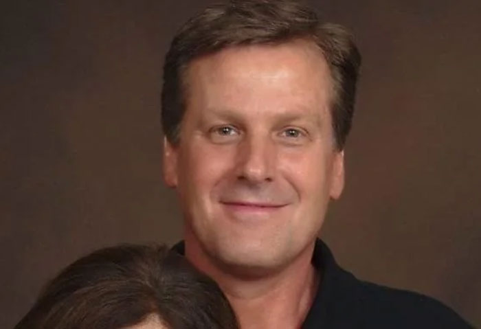 Middle-aged man smiling against a plain background, associated with Florida Man headlines.