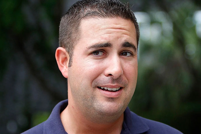 A man in a casual shirt with a perplexed expression, representing a typical 'Florida Man' headline scenario.