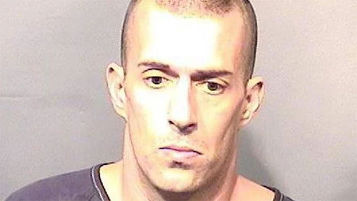 Man in a black shirt, associated with Florida Man headlines, facing forward in a neutral expression.