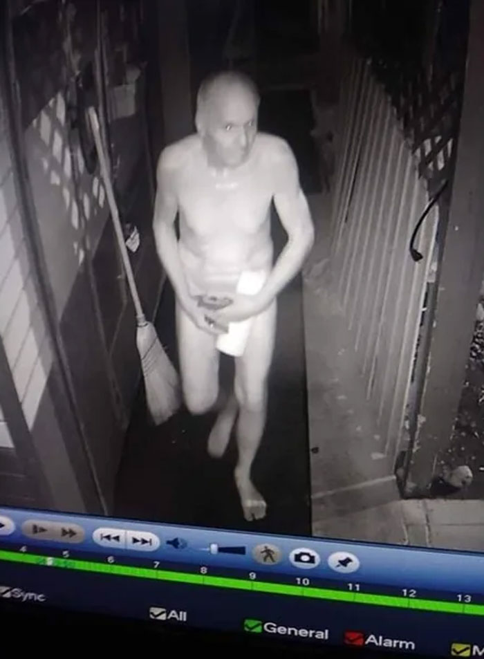 "Florida man caught on security camera at night holding items in a corridor."