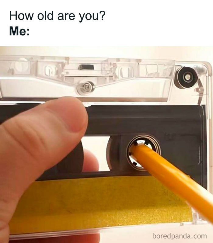 Hand using pencil to rewind cassette tape, a 'sadcastic' meme reflecting on age and nostalgia.