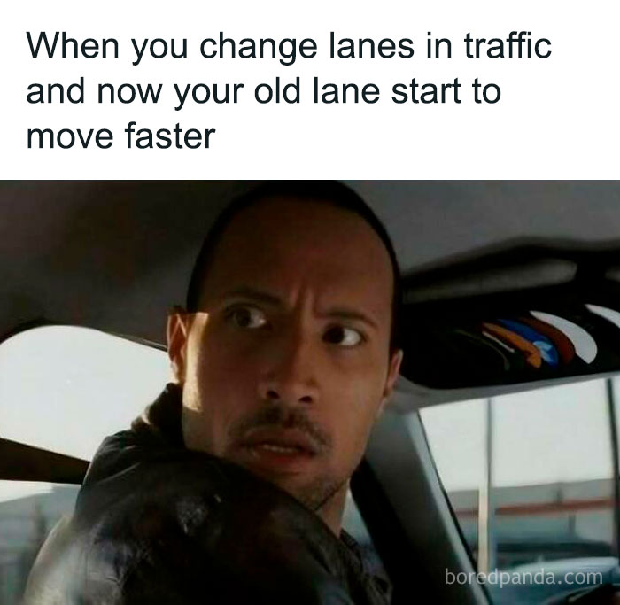 Man in car reacting with surprise, embodying sadcastic memes about traffic lane changes.