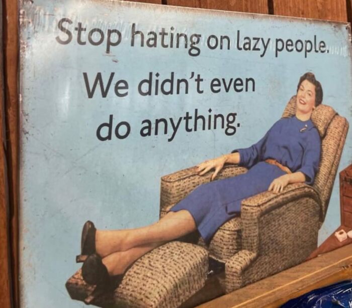 Woman relaxing in a recliner with text about lazy people, capturing a sarcastic meme vibe.