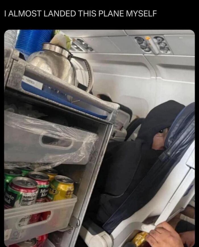Person on a plane in a hoodie looking suspicious next to a snack cart, embodying sarcastic humor.