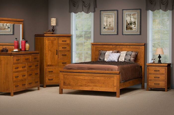 Bedroom with wooden furniture set featuring classic design elements, illustrating poorly-aging interior design trends to avoid.