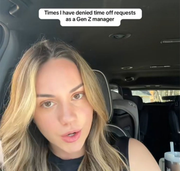 Young manager refusing time-off requests, ensuring PTO saved for vacations, speaking in a car.