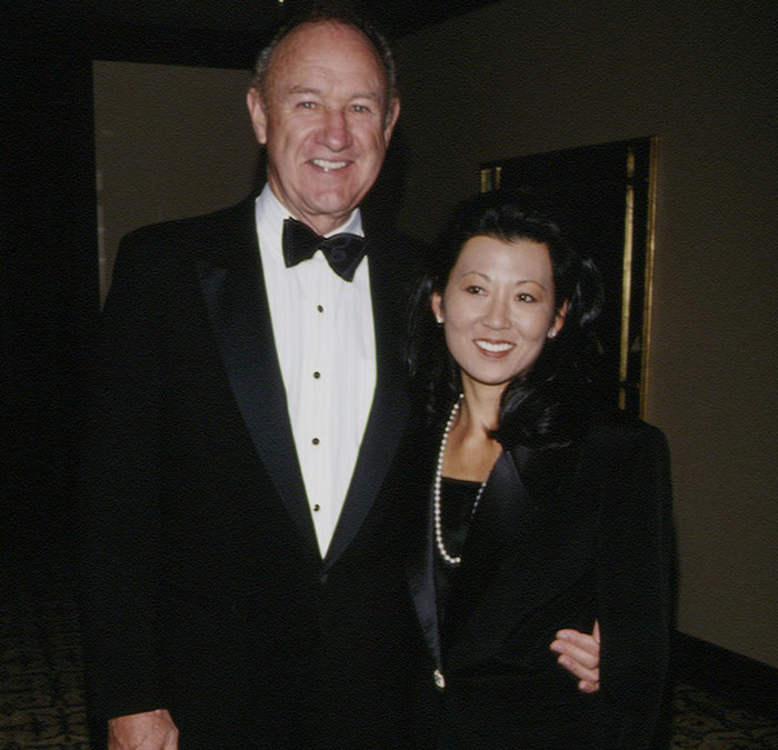 Couple in formal attire, man in tuxedo, linked to Gene Hackman mystery involving his wife's call. Couple in formal attire, man in tuxedo, linked to Gene Hackman mystery involving his wife's call.