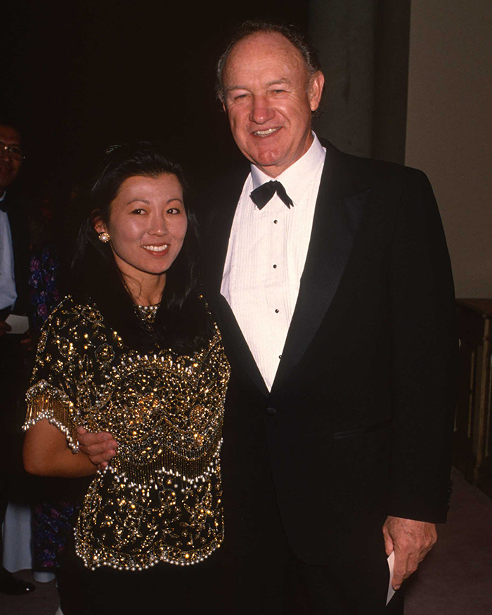 Couple attending an event in formal attire, related to autopsy results discussion.