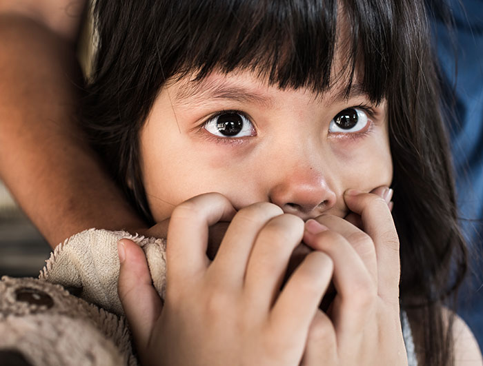 Frightened young girl, representing Kansas trooper's rescue mission story. Frightened young girl, representing Kansas trooper's rescue mission story.