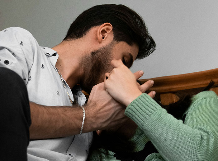 Man and woman interacting closely, highlighting dynamics of "nice guys" stories.