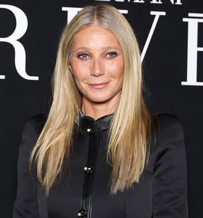 Blonde woman in black blouse at event, related to intimacy coordinator topic.