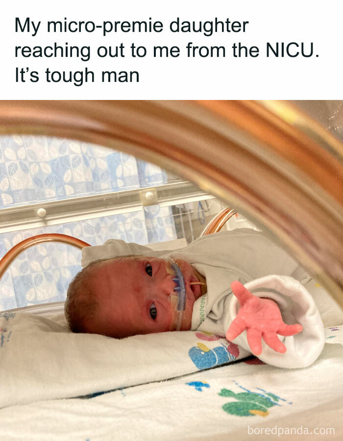Newborn in NICU reaching out with hand, a touching and uplifting moment for a brighter day.