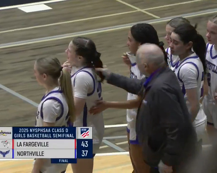 Basketball coach pulling female player's hair in game; lip reader reveals words.