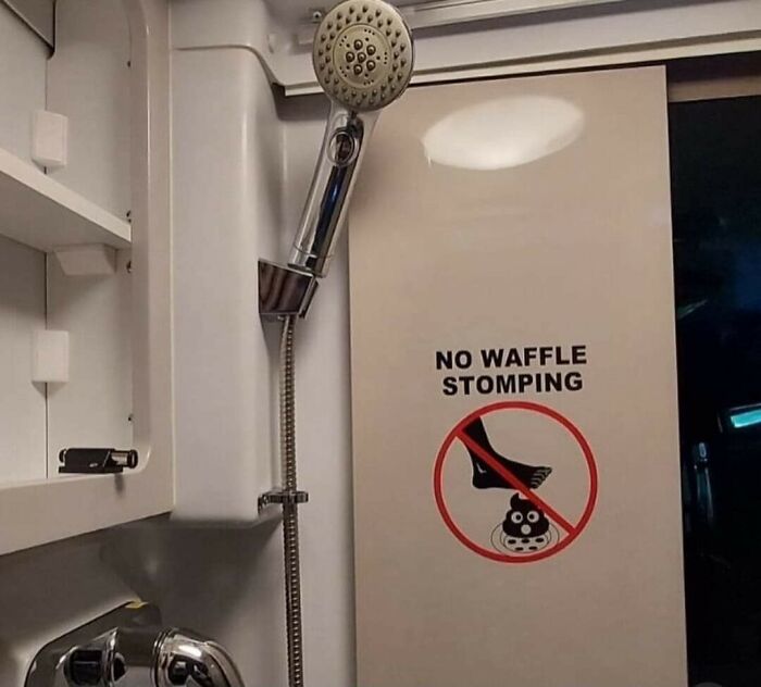 Shower with sign warning against waffle stomping, humorously illustrating big mistake aftermath.