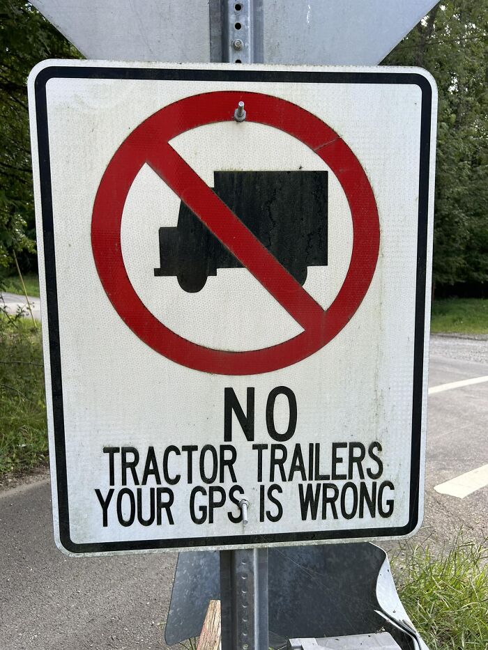 Road sign warning tractor trailers, indicating a potential mistake due to GPS error.