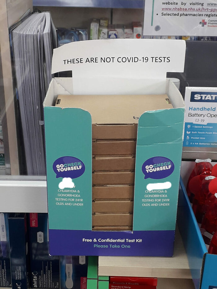 Testing kit display labeled "Not COVID-19 tests," highlighting potential oversight or mistake in product placement.