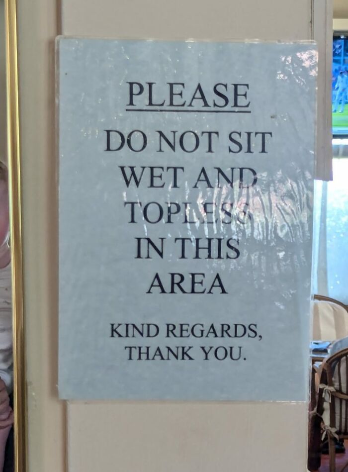 Sign warning against sitting wet and topless in this area, humorous mistake aftermath.