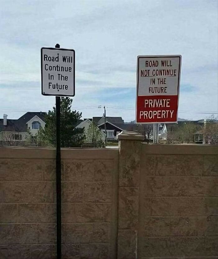 Conflicting road signs on future continuation, illustrating warning signs of a big mistake.