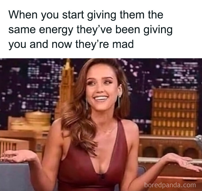 A woman shrugs with a playful smile, captioned about matching others' energy, from Women's Humor memes collection.
