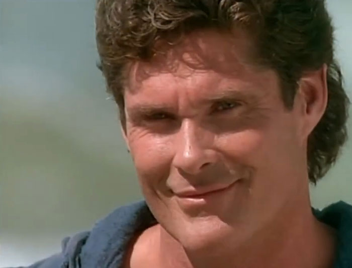 A smiling man against a blurred outdoor background, highlighting experiences of women with icky men in dating.