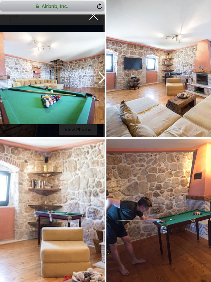 Man playing pool on a small table in a rustic Airbnb with stone walls and modern decor.