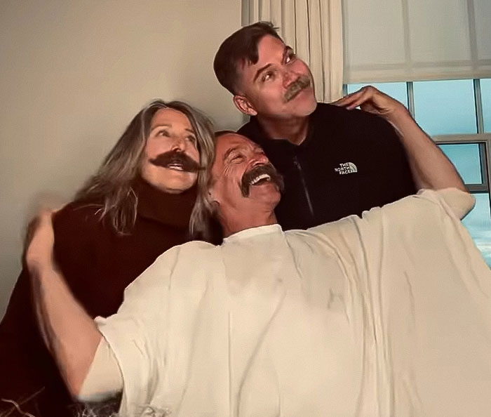 Individuals posing with retro mustaches, reminiscent of '70s Pawn Star' style.