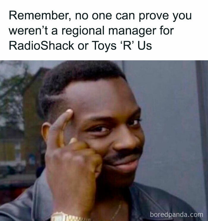Smiling person pointing at head with text about being a manager at RadioShack or Toys 'R Us. Floppy disk nostalgia humor.