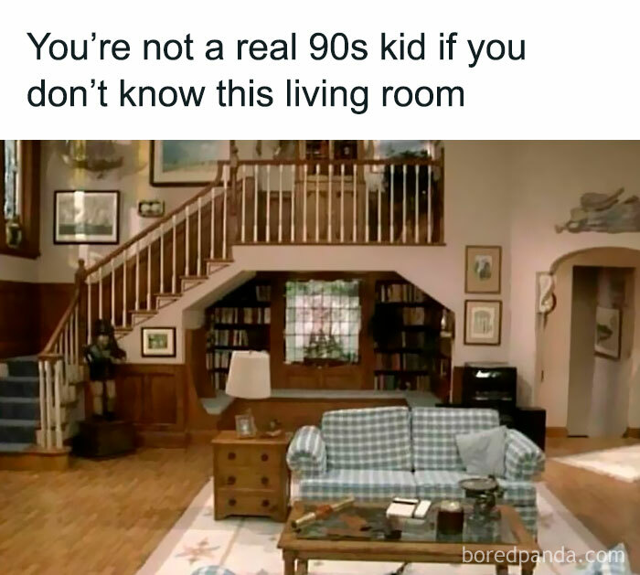 90s living room with plaid sofa and wooden staircase, evoking nostalgia for those familiar with floppy disk era.