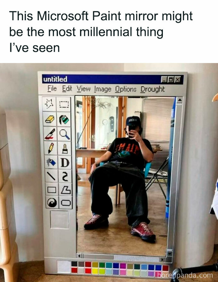 Person taking a selfie in a mirror designed to look like a vintage Microsoft Paint window; a humorous throwback.