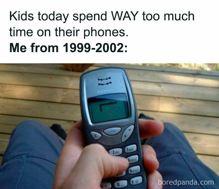 Person holding a vintage Nokia phone, highlighting a funny throwback to early 2000s technology.