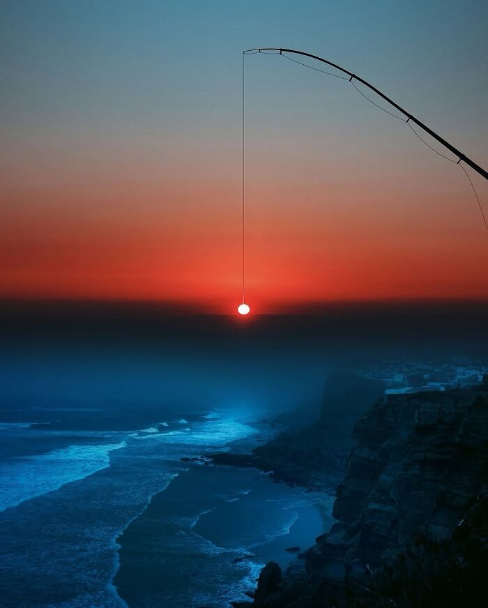 Surreal digital artwork by Ted Chin showing a sunset being reeled in by a fishing rod above a coastal scene.