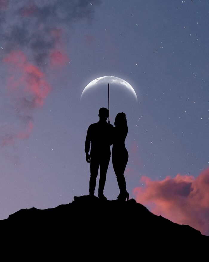 Silhouette photography of a couple with an umbrella under a crescent moon against a starry sky.
