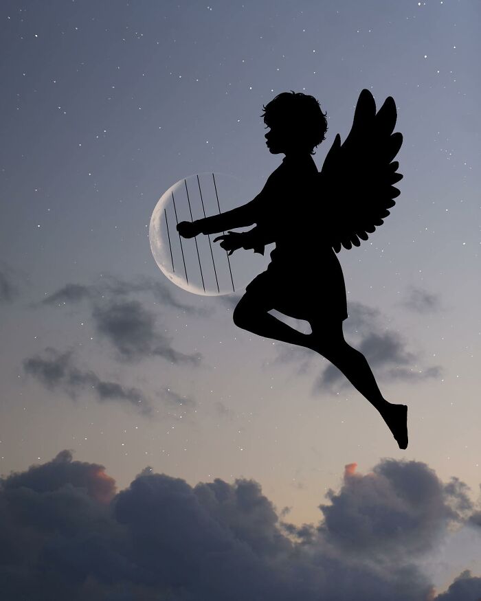 Silhouette photography of an angel playing harp against a starry sky and crescent moon.