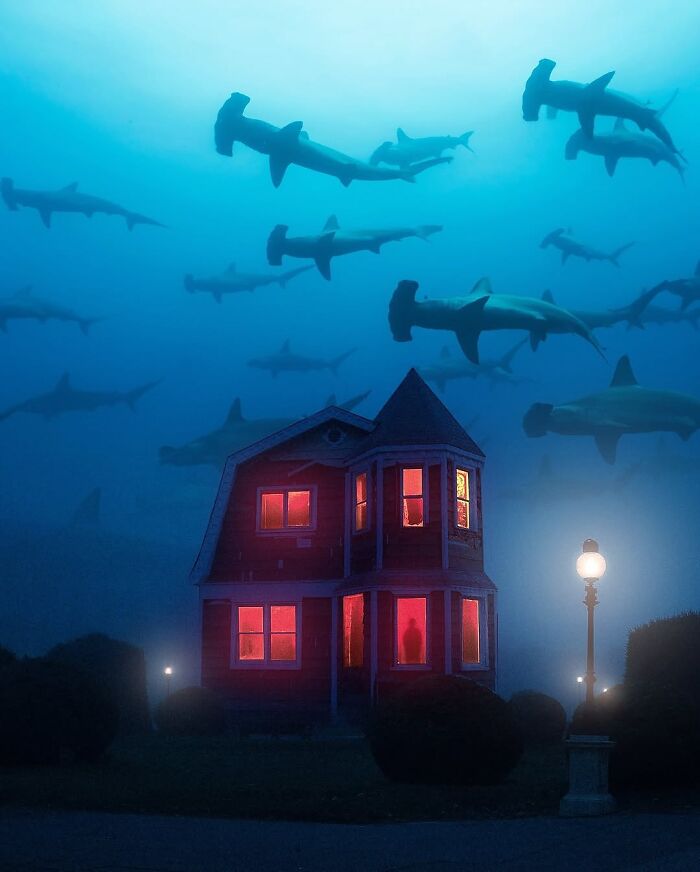 Fantasy and reality blend in Ted Chin's surreal digital artwork of a house underwater among sharks.