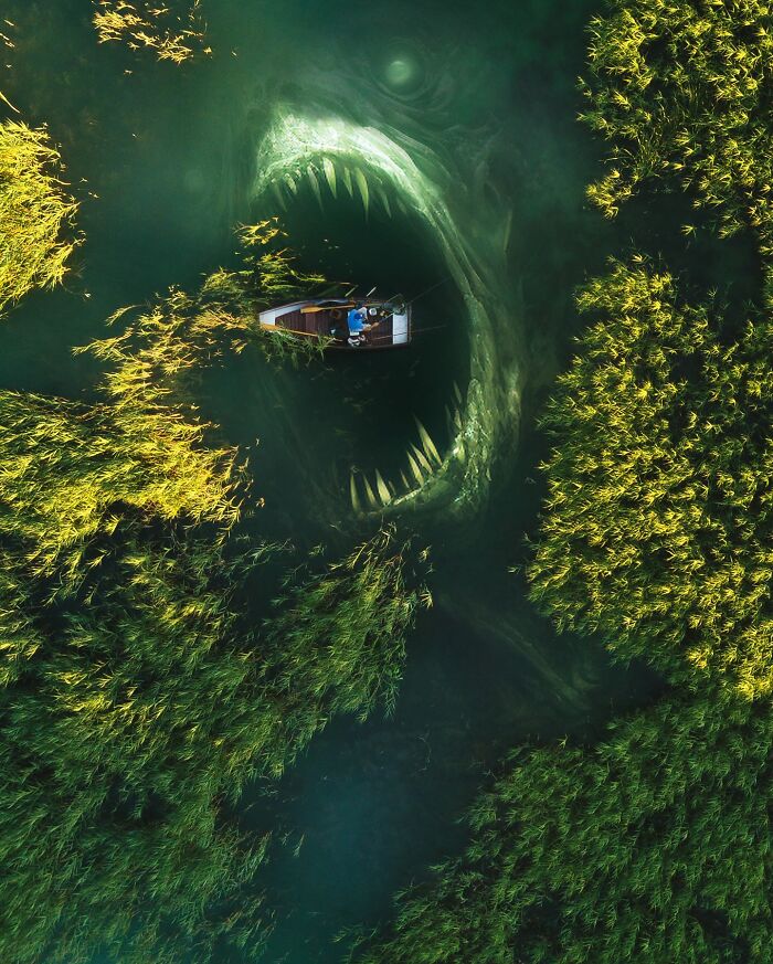 Boat on a lake above a giant surreal sea creature, blending fantasy and reality in digital art.