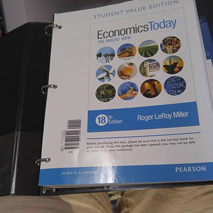 Economics textbook cover showing a thin binder edition, resembling potential scams in educational materials.