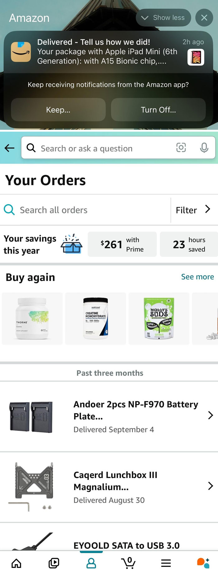 Amazon order screen with scam-like notification.