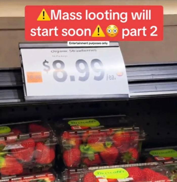 Price tag showing $8.99 for organic strawberries in the US grocery store, sparking outrage over high prices.